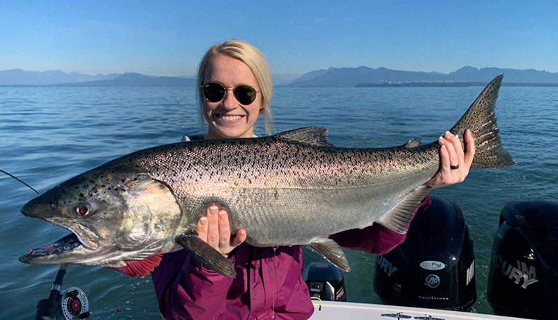 Bon Chovy Fishing Charters Vancouver BC woman and salmon