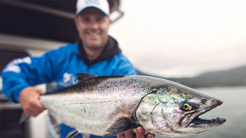 First Fish Charters, c/u man holding fish